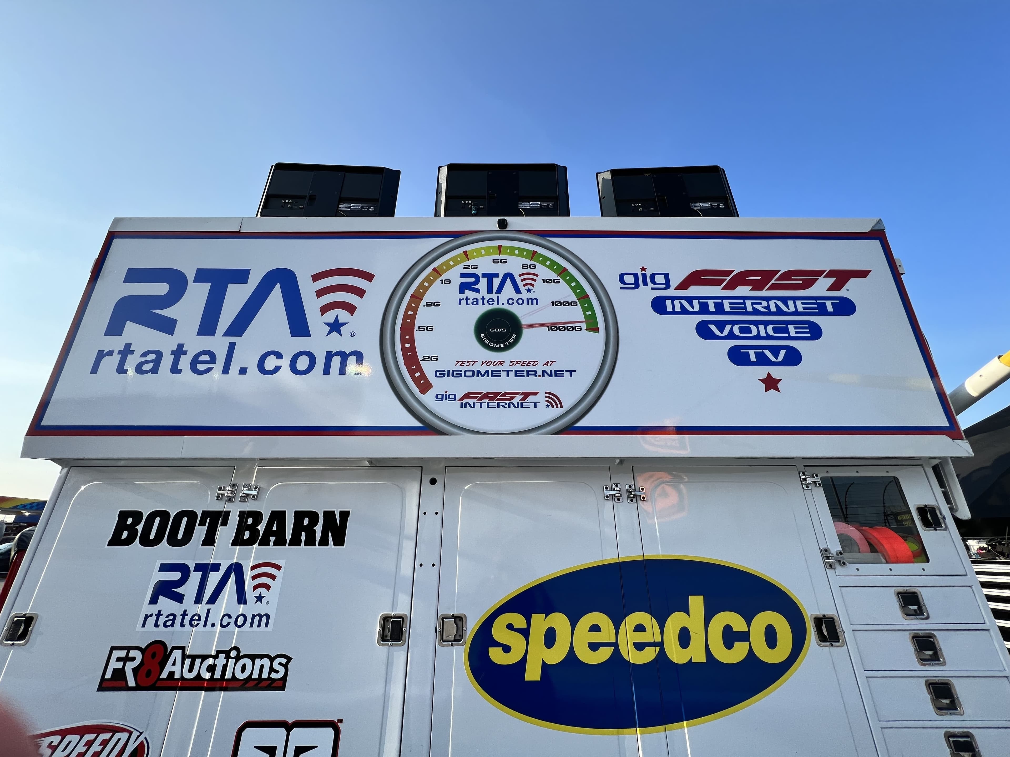 Team hauler panel showing RTA, Gigometer speed dial, and gigFAST Internet branding
